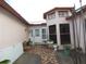 Inviting entrance with unique stained glass windows and tiled walkway at 7308 Mako Dr, Hudson, FL 34667