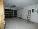 Spacious two car garage with white painted walls and concrete floor for parking and storage at 7308 Mako Dr, Hudson, FL 34667