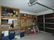 Garage featuring ample shelving, providing plenty of space for storage and organization at 7308 Mako Dr, Hudson, FL 34667