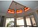 Chandelier lighting, stained glass windows, and natural lighting at 7308 Mako Dr, Hudson, FL 34667