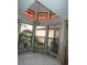 Bright living space featuring unique stained glass windows, chandelier, and large windows at 7308 Mako Dr, Hudson, FL 34667