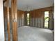 Bright living room with natural light streaming through large windows and modern ceiling fan at 7308 Mako Dr, Hudson, FL 34667