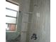 Showing modern shower fixtures and built-in shelves at 7308 Mako Dr, Hudson, FL 34667