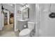Neutral bathroom features a walk-in shower, vanity, and modern fixtures at 7353 Banner St, New Port Richey, FL 34653