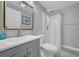 Neutral bathroom features a walk-in shower, vanity, and modern fixtures at 7353 Banner St, New Port Richey, FL 34653