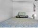 Cozy bedroom featuring a comfortable bed with decorative pillows and dream catcher wall decor at 7353 Banner St, New Port Richey, FL 34653