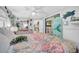 Bright bedroom boasts mermaid decor, closet, wood floors and ceiling fan at 7353 Banner St, New Port Richey, FL 34653