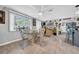 Bright and open dining area adjacent to the kitchen with tile flooring at 7353 Banner St, New Port Richey, FL 34653