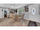 Bright dining area with a glass-top table and stylish wicker chairs at 7353 Banner St, New Port Richey, FL 34653