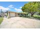 Inviting home exterior with a large driveway and lush landscaping at 7353 Banner St, New Port Richey, FL 34653