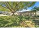 Charming home with a large tree providing shade and curb appeal at 7353 Banner St, New Port Richey, FL 34653
