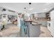 Beautiful kitchen island with barstool seating and an open floorplan to the living area at 7353 Banner St, New Port Richey, FL 34653