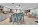 Stylish kitchen island with seating overlooking the dining and living spaces at 7353 Banner St, New Port Richey, FL 34653