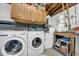 Functional laundry room with modern washer, dryer, and ample storage at 7353 Banner St, New Port Richey, FL 34653