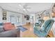 Spacious living room offers lots of seating, natural light, and wood floors at 7353 Banner St, New Port Richey, FL 34653