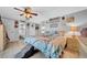 Main bedroom with themed bedding, fan, and en-suite bathroom at 7353 Banner St, New Port Richey, FL 34653