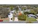 Single-story home with a driveway and mature tree in a suburban neighborhood at 7353 Banner St, New Port Richey, FL 34653