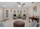 Cozy living room with tile flooring, a bay window, and comfortable seating arrangements at 8002 Sugarbush Dr, Spring Hill, FL 34606