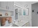 Bright bathroom featuring a large mirror and a modern sink with a large countertop at 8159 Alhambra Ct, Spring Hill, FL 34606