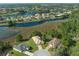 Stunning aerial view of homes with waterfront access and beautiful landscaping in a desirable community at 8910 Jericho Rd, Weeki Wachee, FL 34613