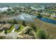 An aerial shot showcasing the property's prime location on a lush green lot with scenic lake views at 8910 Jericho Rd, Weeki Wachee, FL 34613