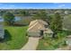 An aerial shot showcasing the property's prime location on a lush green lot with scenic lake views at 8910 Jericho Rd, Weeki Wachee, FL 34613