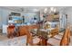 Dining room area featuring a glass-top table, seamlessly connected to the living spaces at 8910 Jericho Rd, Weeki Wachee, FL 34613