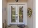 Inviting double door entry featuring glass panels and stylish decor for an enhanced welcome at 8910 Jericho Rd, Weeki Wachee, FL 34613