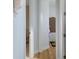 Hallway featuring hardwood floors, ornate corbels, and multiple doorways at 8910 Jericho Rd, Weeki Wachee, FL 34613