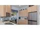 Well-lit kitchen with stainless steel appliances and lots of cabinet space at 8910 Jericho Rd, Weeki Wachee, FL 34613