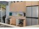 Kitchen featuring cabinets with pull-out shelves and a stainless steel refrigerator at 8910 Jericho Rd, Weeki Wachee, FL 34613