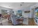 Bright living room featuring wood floors, cozy seating, and a ceiling fan at 8910 Jericho Rd, Weeki Wachee, FL 34613