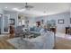 Spacious living room with wood floors and an open floor plan at 8910 Jericho Rd, Weeki Wachee, FL 34613