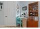 Bright and airy home office with a built in desk, display cabinet and organized shelving at 8910 Jericho Rd, Weeki Wachee, FL 34613