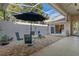 Charming screened-in patio with dining set, offering an inviting space for outdoor entertaining and relaxation at 8910 Jericho Rd, Weeki Wachee, FL 34613