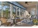 Enclosed sunroom provides a comfortable and relaxing space with lots of natural light and outdoor views at 8910 Jericho Rd, Weeki Wachee, FL 34613