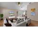 Spacious living room showcasing hardwood floors, modern furnishings, and stylish decor at 9514 Highland Ridge Dr, Hudson, FL 34667