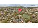 Aerial view of community highlighting scenic pond, mature trees, and surrounding neighborhood at 1002 Caravel Ct, Tarpon Springs, FL 34689