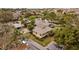 Aerial view of complex and manicured landscaping and mature trees at 1002 Caravel Ct, Tarpon Springs, FL 34689