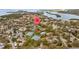 Community aerial view showcasing lakes, tennis courts and pool at 1002 Caravel Ct, Tarpon Springs, FL 34689