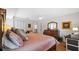 Comfortable bedroom features a large bed with soft linens, wooden furniture, and a calming atmosphere at 1002 Caravel Ct, Tarpon Springs, FL 34689