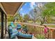 Relaxing covered deck with comfortable seating, offering scenic views of the surrounding nature at 1002 Caravel Ct, Tarpon Springs, FL 34689