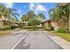 Charming building exteriors with mature landscaping, showcasing a welcoming neighborhood environment at 1002 Caravel Ct, Tarpon Springs, FL 34689