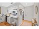 Bright, newly renovated kitchen featuring stainless steel appliances, countertops and hardwood floors at 1002 Caravel Ct, Tarpon Springs, FL 34689