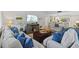 Living room with comfortable seating, TV, and view to the kitchen at 1002 Caravel Ct, Tarpon Springs, FL 34689