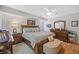 Spacious main bedroom features a king-size bed, hardwood floors, and ample closet space at 1002 Caravel Ct, Tarpon Springs, FL 34689