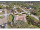 Aerial view of the property, showcasing a large lot, sparkling pool and mature landscaping at 1011 Altoona Ave, Spring Hill, FL 34609