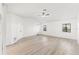 Bright bedroom featuring neutral decor, a ceiling fan and multiple windows at 1011 Altoona Ave, Spring Hill, FL 34609