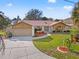 Well maintained single Gathering home with beautiful landscaping and a long driveway at 1011 Altoona Ave, Spring Hill, FL 34609
