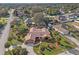 Stunning aerial view of a single-story home with mature landscaping and a circular driveway at 1011 Altoona Ave, Spring Hill, FL 34609